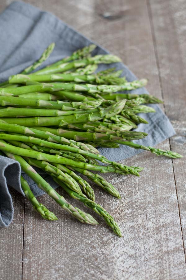 Spring Asparagus Galette | BourbonandHoney.com -- Cheesy, crispy and packed with veggies, this Spring Asparagus Galette is perfect for Easter, Mother's day or a family brunch!