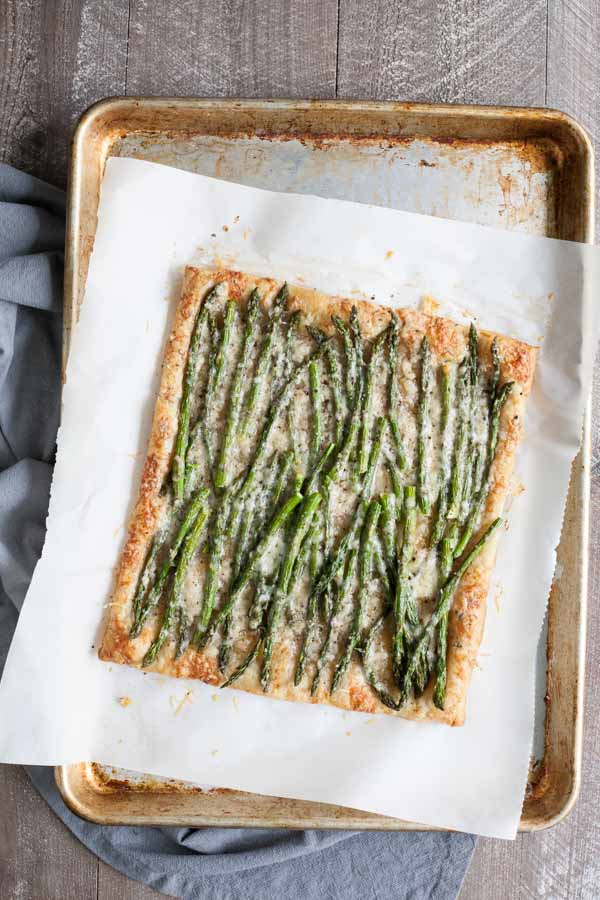 Spring Asparagus Galette | BourbonandHoney.com -- Cheesy, crispy and packed with veggies, this Spring Asparagus Galette is perfect for Easter, Mother's day or a family brunch!