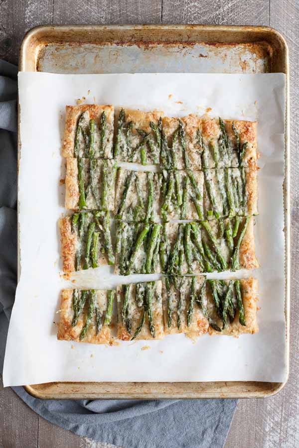 Spring Asparagus Galette | BourbonandHoney.com -- Cheesy, crispy and packed with veggies, this Spring Asparagus Galette is perfect for Easter, Mother's day or a family brunch!