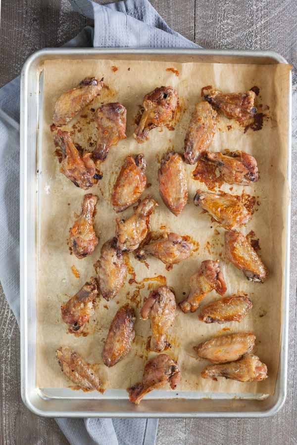 Bourbon and Honey Baked Chicken Wings | BourbonandHoney.com -- These Bourbon and Honey Baked Chicken Wings are sticky, messy, boozy and oh so flavorful! They're perfect for game day, or any-day!