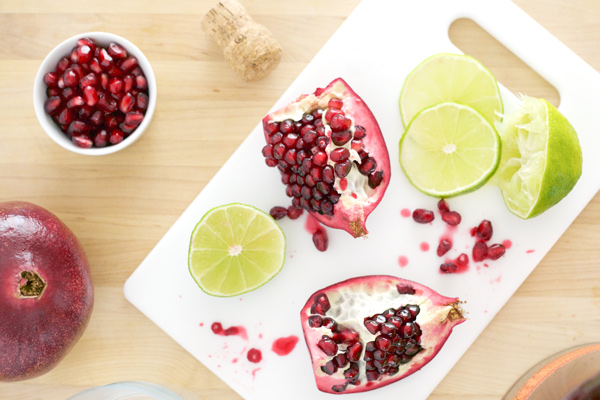 Bourbon Pomegranate Punch | BourbonAndHoney.com -- This Bourbon Pomegranate Punch recipe is the perfect big batch cocktail to serve at your next party. It's bubbly, flavorful and full of holiday cheer!