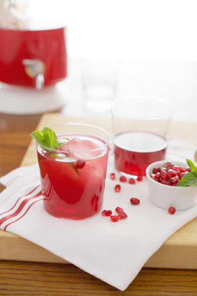 Bourbon Pomegranate Punch | BourbonAndHoney.com -- This Bourbon Pomegranate Punch recipe is the perfect big batch cocktail to serve at your next party. It's bubbly, flavorful and full of holiday cheer!