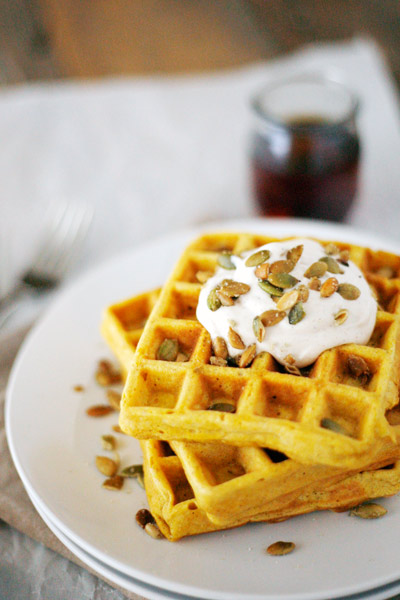 Pumpkin Spice Waffles with Maple Cream and Pepitas | BourbonAndHoney -- Pumpkin Spice Waffles, a great weekend breakfast made with pumpkin puree and topped with maple cream, syrup and toasted pepitas.
