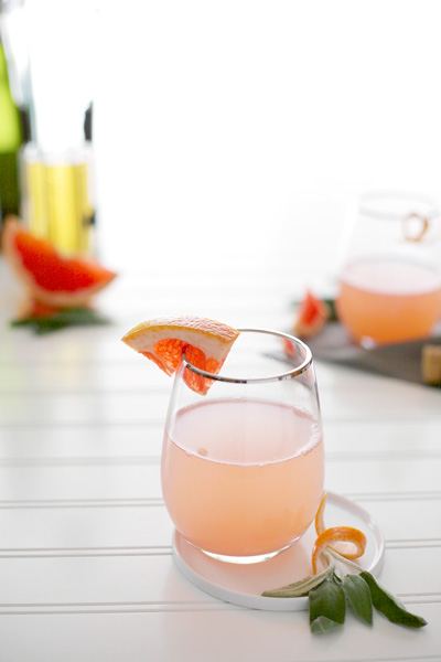 Sage and Grapefruit Mimosa | BourbonAndHoney.com -- A fresh twist on the traditional mimosa recipe. This Sage and Grapefruit Mimosa is fresh, sweet and delicate; the perfect way to update brunch.