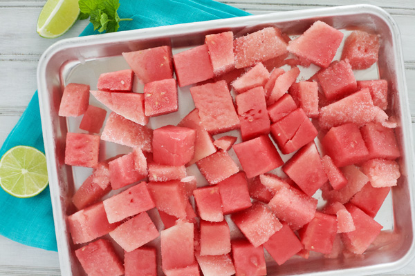 Watermelon Tequila Slush | BourbonandHoney.com -- This frosty, boozy and pretty pink Watermelon Tequila Slush cocktail is a tasty and refreshing way to keep you cool all summer long.