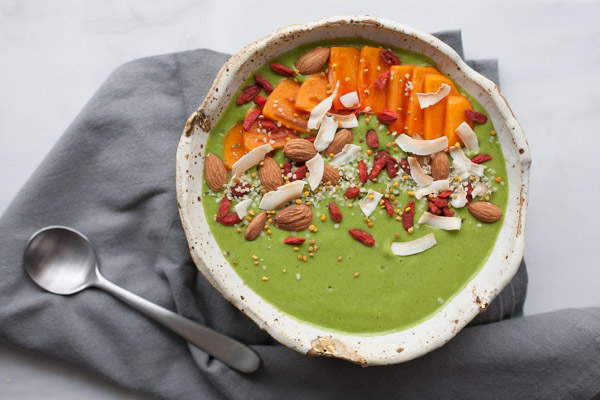 Green Smoothie Bowl | BourbonandHoney.com -- This kale and mango Green Smoothie Bowl is topped with fresh and tasty toppings for a healthy pick-me-up. 