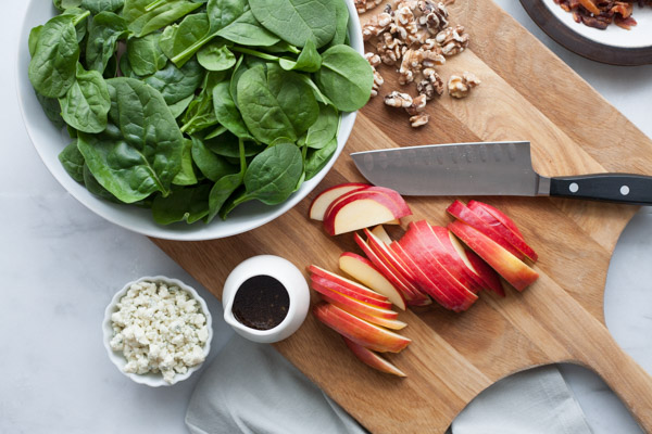 Apple, Blue Cheese and Bacon Chop Salad | BourbonandHoney.com -- This chopped bacon and blue cheese salad is packed with fresh apples, crumbled blue cheese, crispy bacon topped with a dijon vinaigrette.