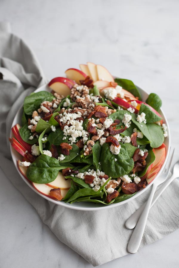 Apple, Blue Cheese and Bacon Chop Salad | BourbonandHoney.com -- This chopped bacon and blue cheese salad is packed with fresh apples, crumbled blue cheese, crispy bacon topped with a dijon vinaigrette.