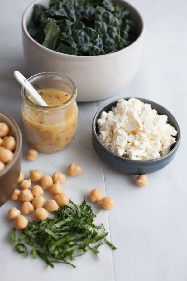 Kale and Farro Salad with Chickpeas | BourbonandHoney.com -- Fresh, hearty and delicious, this Kale and Farro Salad is packed with kale, a light lemon dressing and a sprinkling of feta cheese.