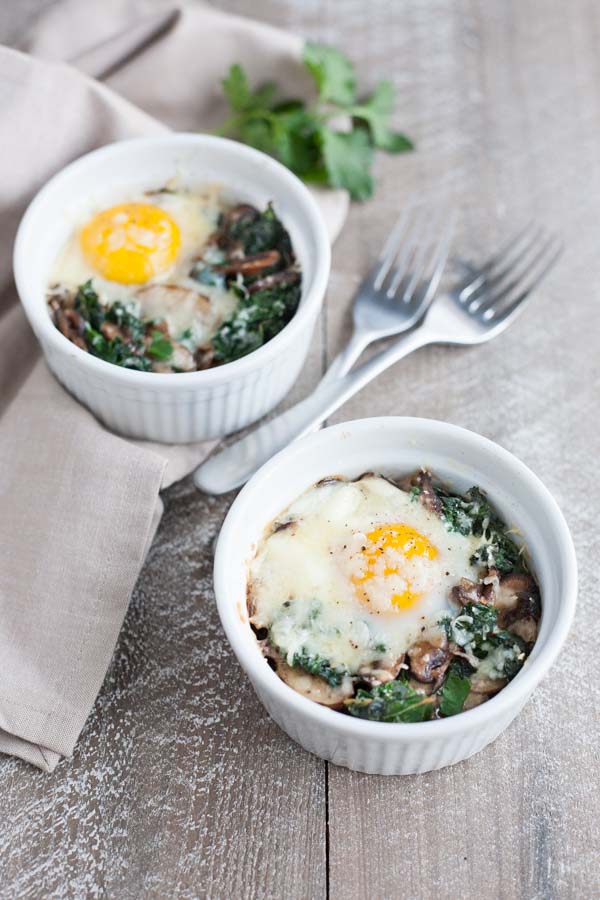 Baked Eggs with Kale and Mushrooms | BourbonandHoney.com -- These creamy, indulgent Baked Eggs with Kale and Mushrooms are perfect for a lazy weekend breakfast. 