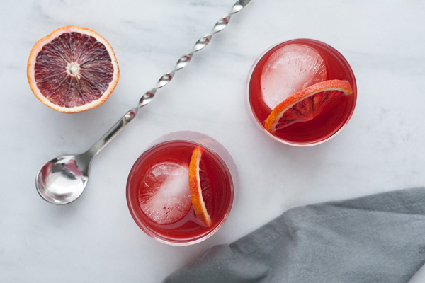 Blood Orange Negroni | BourbonandHoney.com -- This delicious Blood Orange Negroni is citrusy, light and the perfect cocktail to brighten your winter.