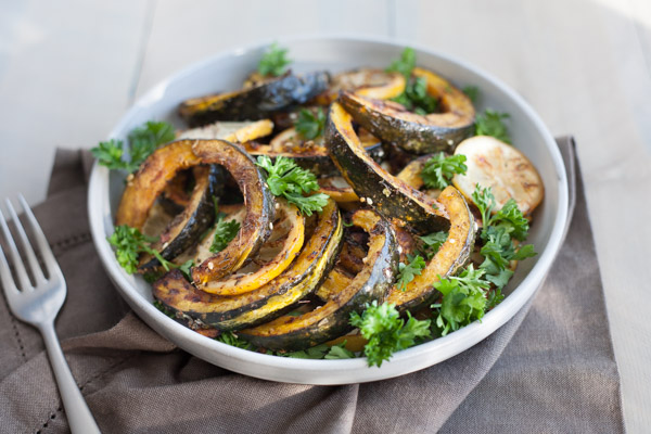 Roasted Acorn Squash with Tahini Yogurt Sauce | BourbonandHoney.com -- Seasonal Roasted Acorn Squash with Za’atar seasoning and a Tahini Yogurt Sauce; a flavorful and healthy side dish!