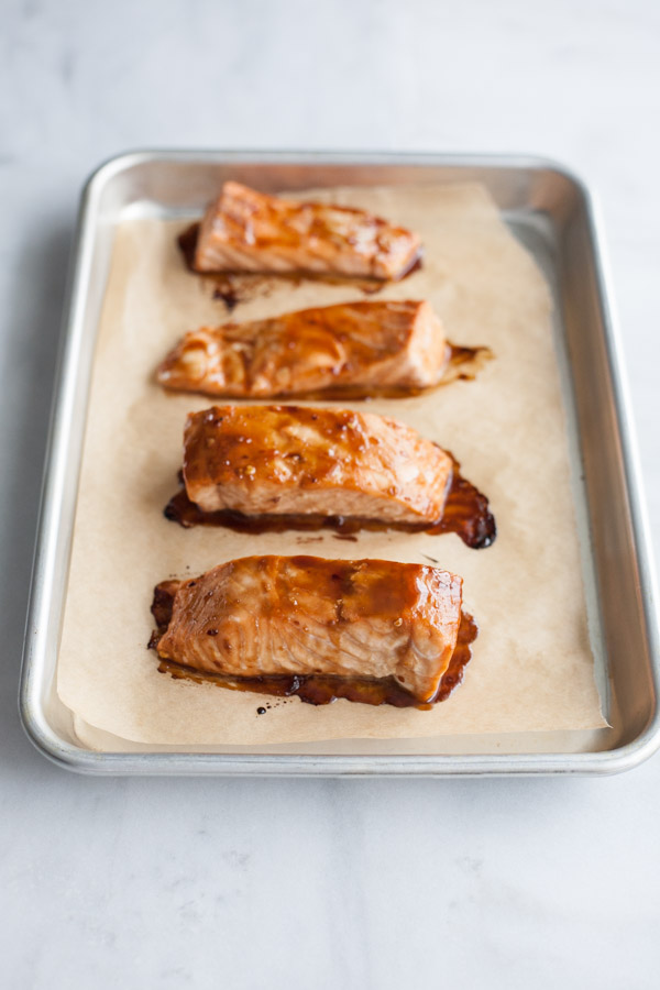 Soy Glazed Salmon Rice Bowl | BourbonandHoney.com -- Sweet and spicy soy glazed salmon topped with avocado, roasted asparagus, these salmon rice bowls are an easy favorite!