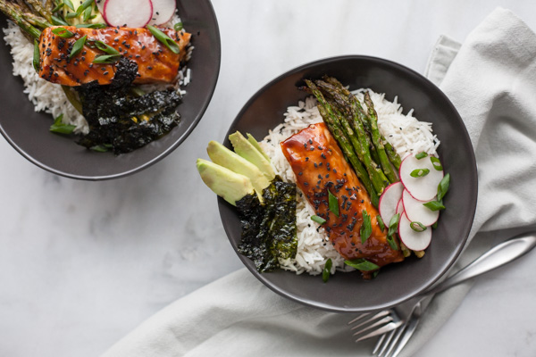 Soy Glazed Salmon Rice Bowl | BourbonandHoney.com -- Sweet and spicy soy glazed salmon topped with avocado, roasted asparagus, these salmon rice bowls are an easy favorite!