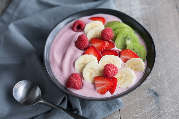 Strawberry Banana Smoothie Bowl | BourbonandHoney.com -- Simple, delicious and packed with fruit, this Strawberry Banana Smoothie Bowl is a great breakfast on the go!