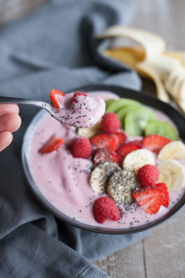 Strawberry Banana Smoothie Bowl | BourbonandHoney.com -- Simple, delicious and packed with fruit, this Strawberry Banana Smoothie Bowl is a great breakfast on the go!