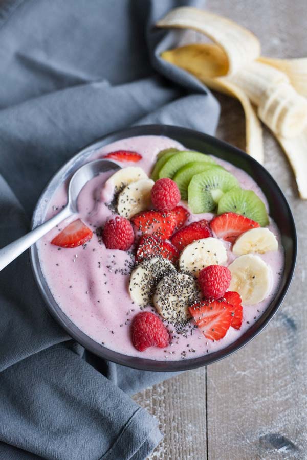 Strawberry Banana Smoothie Bowl | BourbonandHoney.com -- Simple, delicious and packed with fruit, this Strawberry Banana Smoothie Bowl is a great breakfast on the go!