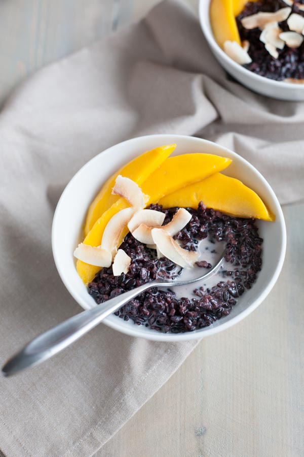 Black Rice Pudding with Coconut and Mango | BourbonandHoney.com Square -- Warm, comforting and delicious, this Black Rice Pudding with Coconut and Mango is perfect for breakfast, a snack or even dessert!