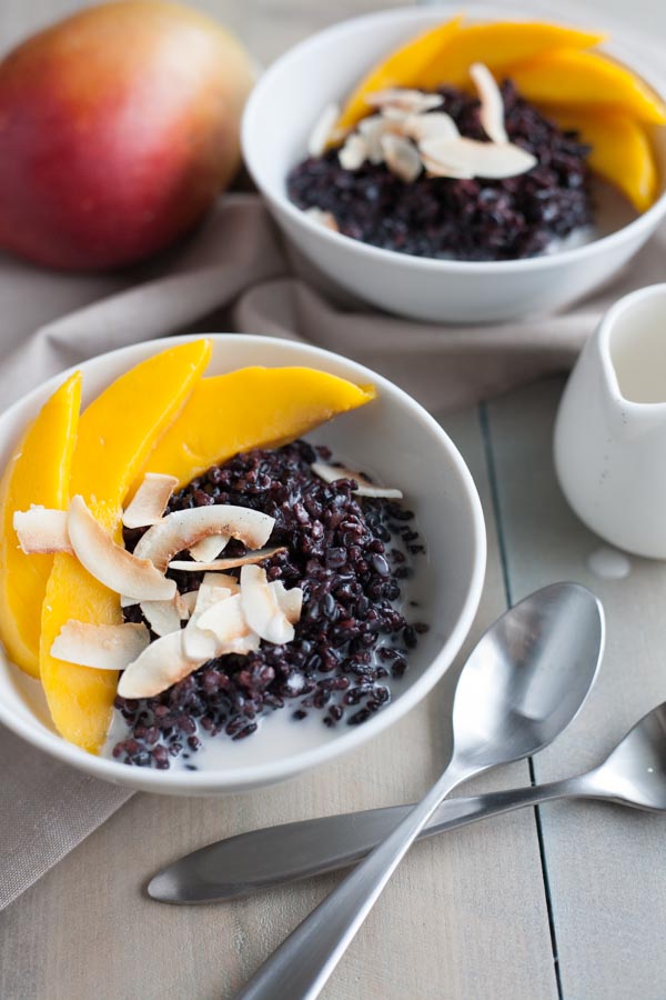 Black Rice Pudding with Coconut and Mango | BourbonandHoney.com Square -- Warm, comforting and delicious, this Black Rice Pudding with Coconut and Mango is perfect for breakfast, a snack or even dessert!