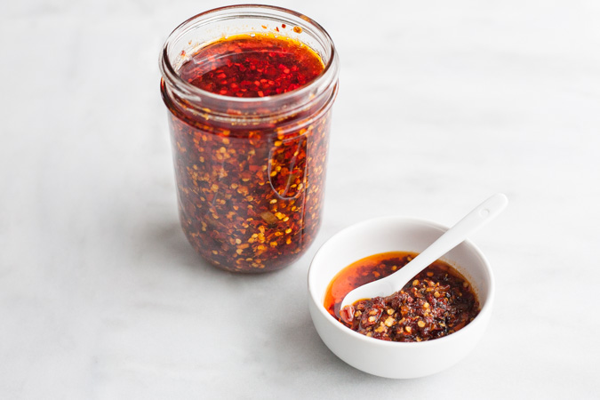 Crunchy Chile Sauce | BourbonandHoney.com -- This hot sauce is savory, spicy and totally delicious. Spoon it on everything from rice bowls to scrambled eggs, roasted veggies or nachos.