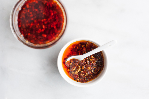 Crunchy Chile Sauce | BourbonandHoney.com -- This hot sauce is savory, spicy and totally delicious. Spoon it on everything from rice bowls to scrambled eggs, roasted veggies or nachos.