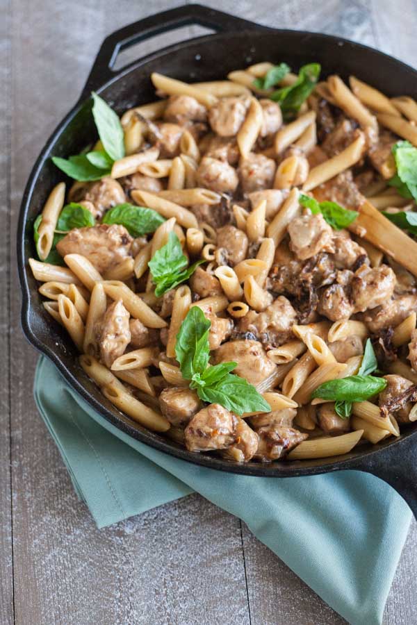 Penne with Chicken and Sun Dried Tomatoes | BourbonandHoney.com -- This Penne with Chicken dish takes dinner to the next level with a bit of cheese, sun dried tomato and some pasta for a quick and weeknight meal.