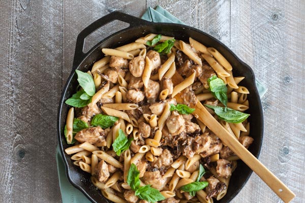 Penne with Chicken and Sun Dried Tomatoes | BourbonandHoney.com -- This Penne with Chicken dish takes dinner to the next level with a bit of cheese, sun dried tomato and some pasta for a quick weeknight meal.