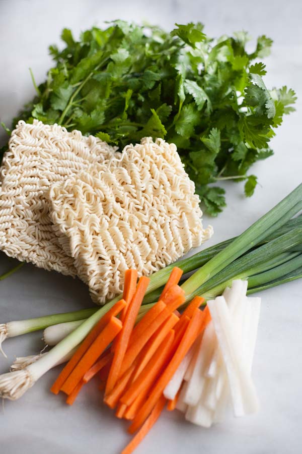 Slow Cooker Ramen | BourbonandHoney.com -- The complex flavors of ramen are made easy with this Slow Cooker Ramen recipe with all the yummy toppers you could want!