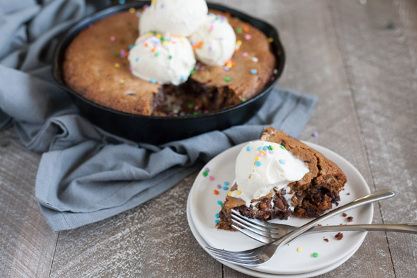 Bourbon and Honey Brown Butter Chocolate Chunk Skillet Cookie | BourbonandHoney.com -- This over-the-top Brown Butter Chocolate Chunk Skillet Cookie is spiked with Bourbon and Honey and perfect for celebrating!