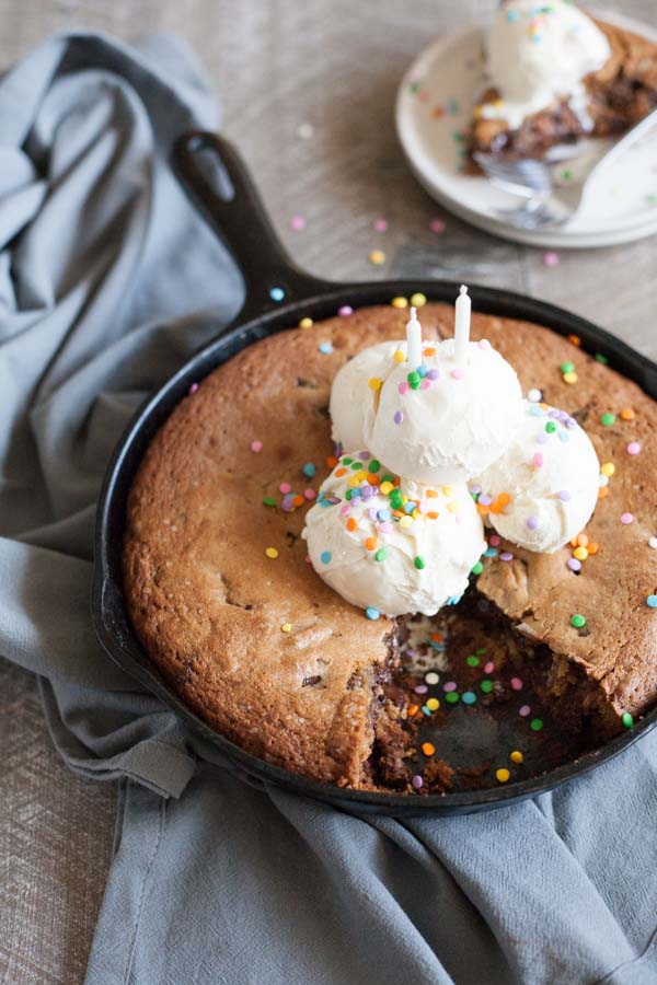 Bourbon and Honey Brown Butter Chocolate Chunk Skillet Cookie | BourbonandHoney.com -- This over-the-top Brown Butter Chocolate Chunk Skillet Cookie is spiked with Bourbon and Honey and perfect for celebrating!