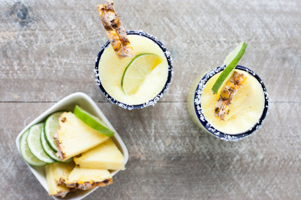 Frozen Pineapple Margaritas | BourbonandHoney.com -- Sweet, frosty and totally refreshing, these tequila spiked frozen pineapple margaritas are going to sweeten your weekend! 