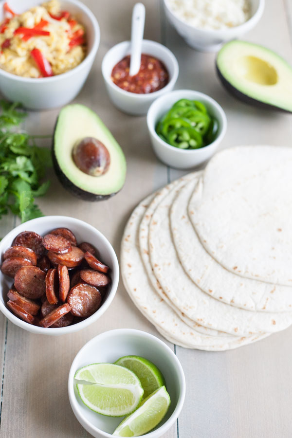 Scrambled Egg and Chorizo Breakfast Tacos | BourbonandHoney.com -- These fully loaded Scrambled Egg and Chorizo Breakfast Tacos are an easy, tasty and customizable breakfast that everyone will love.