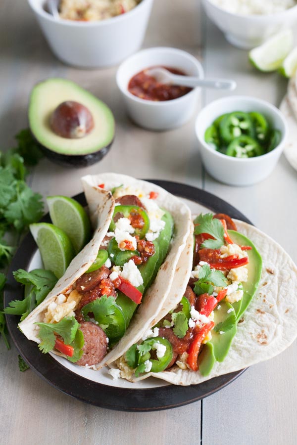 Scrambled Egg and Chorizo Breakfast Tacos | BourbonandHoney.com -- These fully loaded Scrambled Egg and Chorizo Breakfast Tacos are an easy, tasty and customizable breakfast that everyone will love.