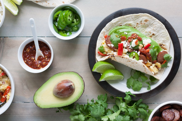 Scrambled Egg and Chorizo Breakfast Tacos | BourbonandHoney.com -- These fully loaded Scrambled Egg and Chorizo Breakfast Tacos are an easy, tasty and customizable breakfast that everyone will love.