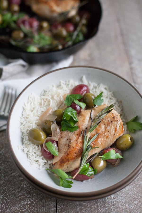 Skillet Chicken with Olives and Rosemary | BourbonandHoney.com -- This flavorful and delicious Skillet Chicken with Olives and Rosemary is an impressive dinner recipe for guests and an easy weeknight meal!