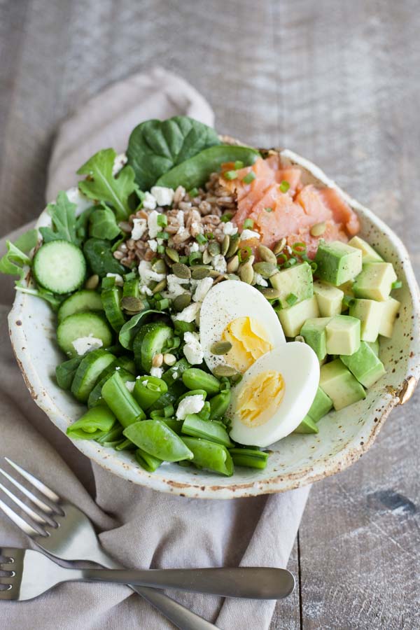 Smoked Salmon Farro Salad Bowls | BourbonandHoney.com -- This Smoked Salmon Farro Salad Bowl is a fresh and hearty recipe packed with tasty toppings and a light garlic-lime vinaigrette.