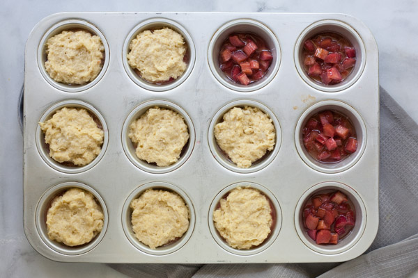 Rhubarb Upside-Down Cupcakes | BourbonandHoney.com --Tangy, tender and slightly sweet, these Rhubarb Upside-Down Cupcakes are an easy and tasty summer treat topped with ice cream!