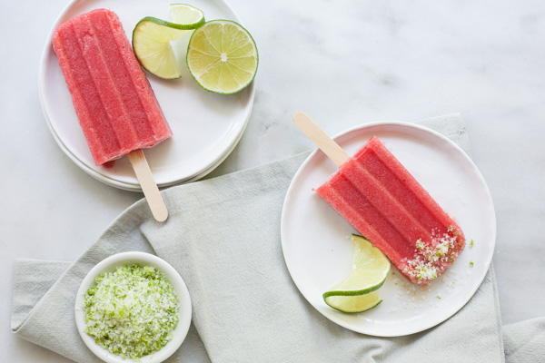 Strawberry Margarita Frozen Pops | BourbonandHoney.com -- These tequila spiked Strawberry Margarita Frozen Pops will be your new go-to summer treat. They're boozy, fruity and perfectly frosty on a hot day! 