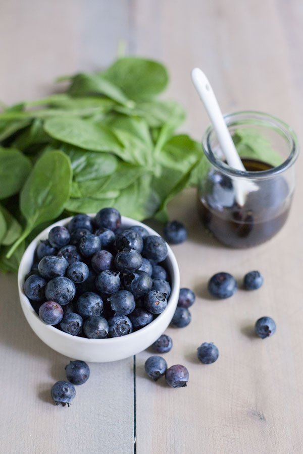 Blueberry, Quinoa and Spinach Salad with Balsamic Vinaigrette | BourbonandHoney.com -- Summery, fresh and delicious this Blueberry, Quinoa and Spinach Salad is simple and packed with colorful berries and crumbled goat cheese.