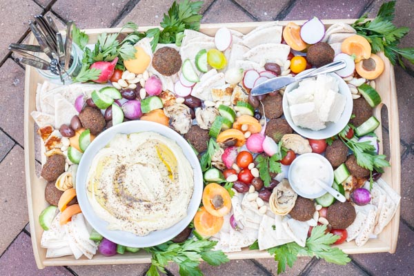 Ultimate Mediterranean Hummus Platter | BourbonandHoney.com -- Ultimate Mediterranean Hummus Platter | BourbonandHoney.com -- This Mediterranean Hummus platter is the ultimate party appetizer. No need to make anything from scratch, just throw together your favorite ingredients for a seriously simple yet impressive snack.
