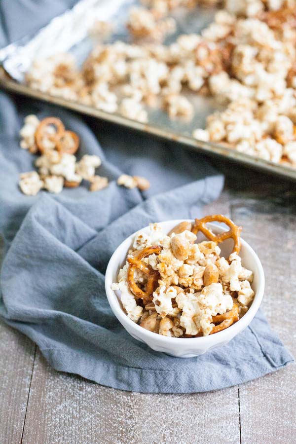 Bourbon and Honey Caramel Corn | BourbonandHoney.com -- Salty pretzels and crunchy nuts make this Bourbon and Honey Caramel Corn perfectly sweet and salty for a delicious food gift of tasty snack!