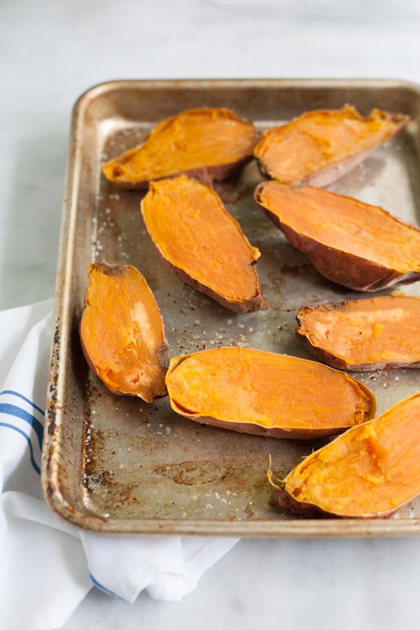 Greek Baked Sweet Potatoes | BourbonandHoney.com -- These simple Greek Baked Sweet Potatoes are a hearty, healthy and flavorful weeknight recipe or a great brown bag lunch.