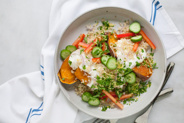 Greek Baked Sweet Potatoes | BourbonandHoney.com -- These simple Greek Baked Sweet Potatoes are a hearty, healthy and flavorful weeknight recipe or a great brown bag lunch.