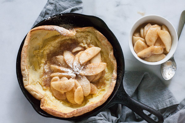 Apple Cinnamon Oven Pancake | BourbonandHoney.com -- Light and airy, this puffy Apple Cinnamon Oven Pancake is the perfect breakfast recipe, for your favorite fall apples or fresh fruit!