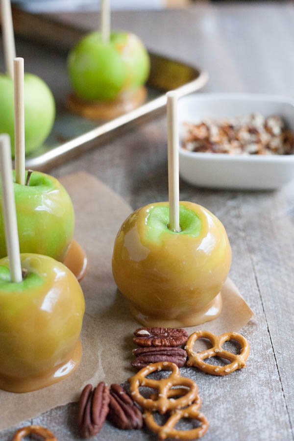 Bourbon and Honey Caramel Apples | BourbonandHoney.com -- Sweet, spiked and perfect for a chilly fall, these Bourbon and Honey Caramel Apples are a great homemade sweet treat or snack!