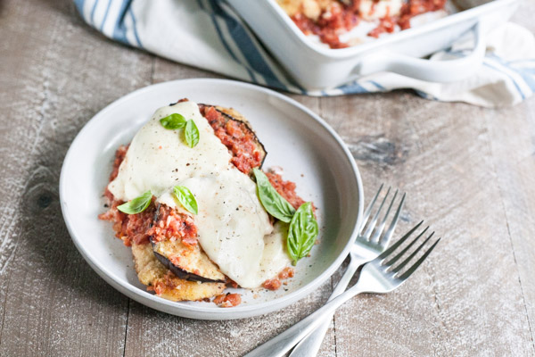 Eggplant Chicken Parmesan | BourbonandHoney.com -- Cheesy, delicious and in the oven in just 30 minutes, this Eggplant Chicken Parmesan dish is the best way to enjoy two of your favorite recipes.