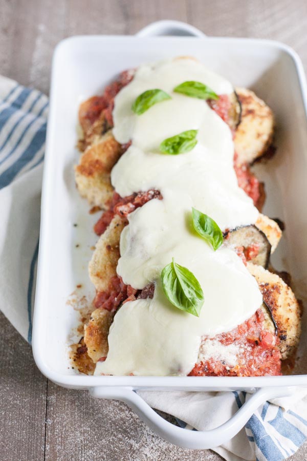 Eggplant Chicken Parmesan | BourbonandHoney.com -- Cheesy, delicious and in the oven in just 30 minutes, this Eggplant Chicken Parmesan dish is the best way to enjoy two of your favorite recipes.