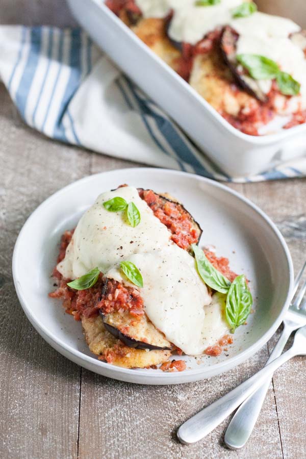 Eggplant Chicken Parmesan | BourbonandHoney.com -- Cheesy, delicious and in the oven in just 30 minutes, this Eggplant Chicken Parmesan dish is the best way to enjoy two of your favorite recipes.