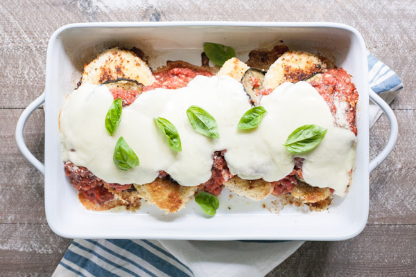 Eggplant Chicken Parmesan | BourbonandHoney.com -- Cheesy, delicious and in the oven in just 30 minutes, this Eggplant Chicken Parmesan dish is the best way to enjoy two of your favorite recipes.