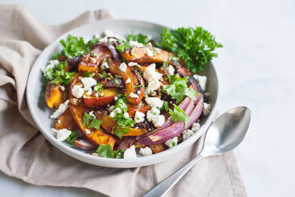 Spicy Roasted Pumpkin with Honey and Feta | BourbonandHoney.com -- This Spicy Roasted Pumpkin recipe is a quick and easy gluten free side dish with sweet caramelized honey, feta cheese and pumpkin seeds.